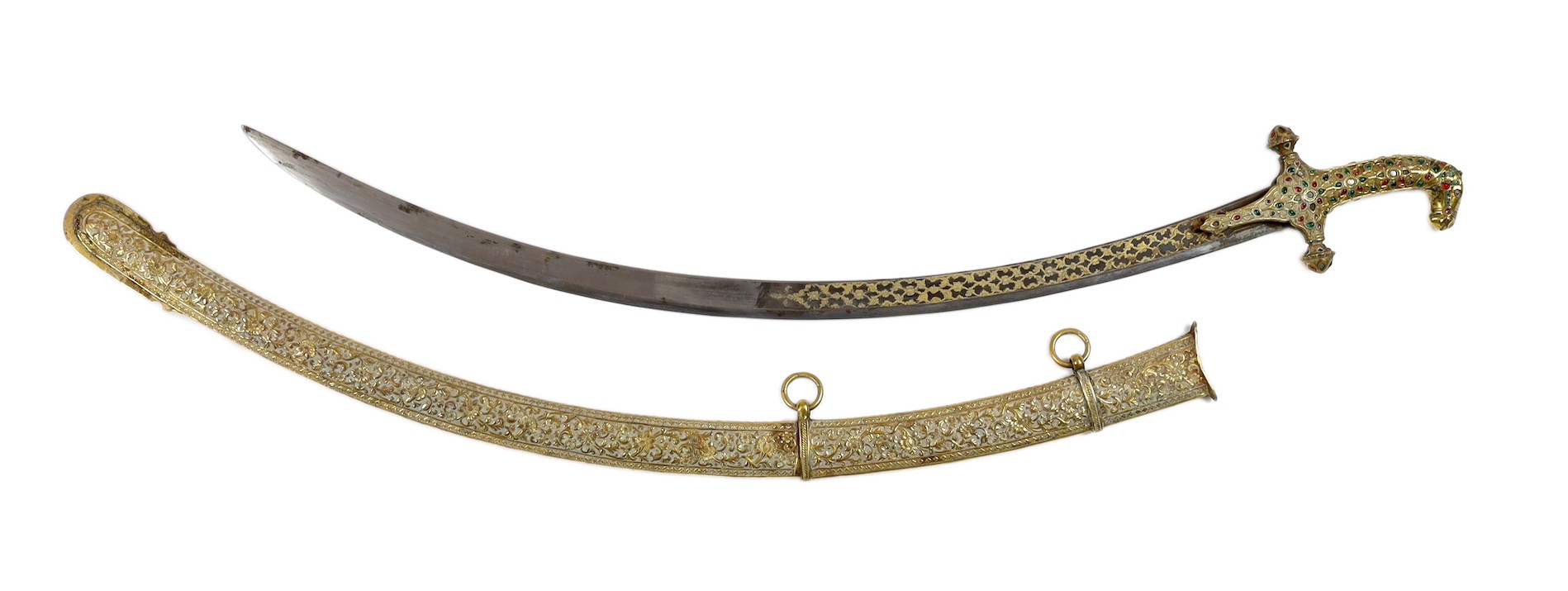 A fine Indian gilt copper and paste mounted sword (shamshir), Kutch, 19th century, sword 79cm long, scabbard 75cm long